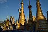 Inle Lake Myanmar. Indein, on the summit of a hill the  Shwe Inn Thein Paya a cluster of hundreds of ancient stupas. Many of them are ruined and overgrown with bushes. 